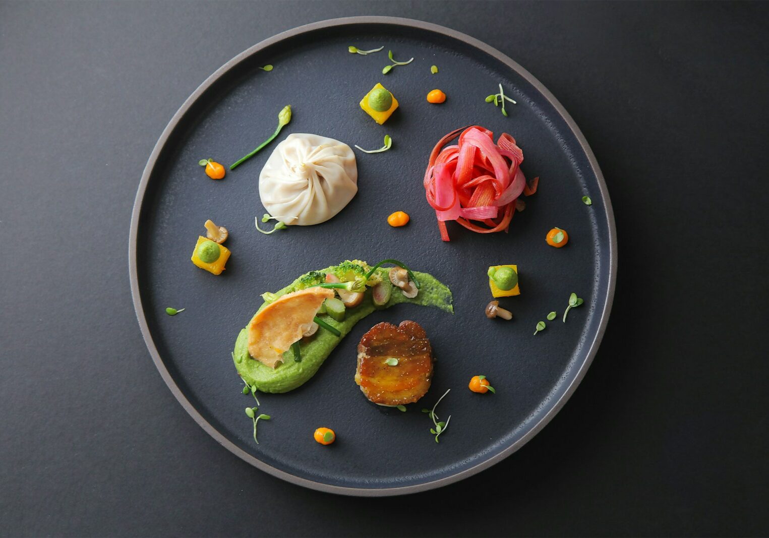 brown and white food on black ceramic plate